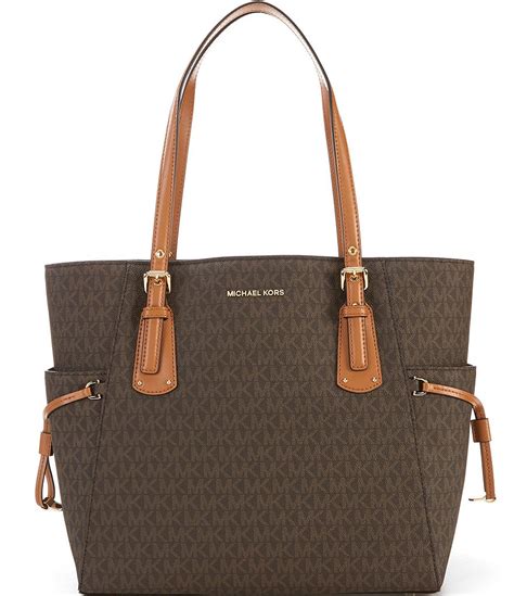 michael kors signature logo tote|Michael Kors voyager signature tote.